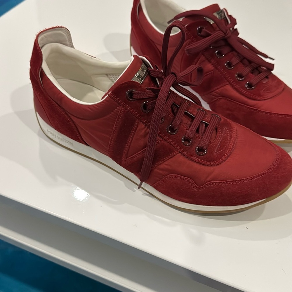 Brand new, US size 7 1/2 Louis Vuitton red sneakers. Dust bag included.